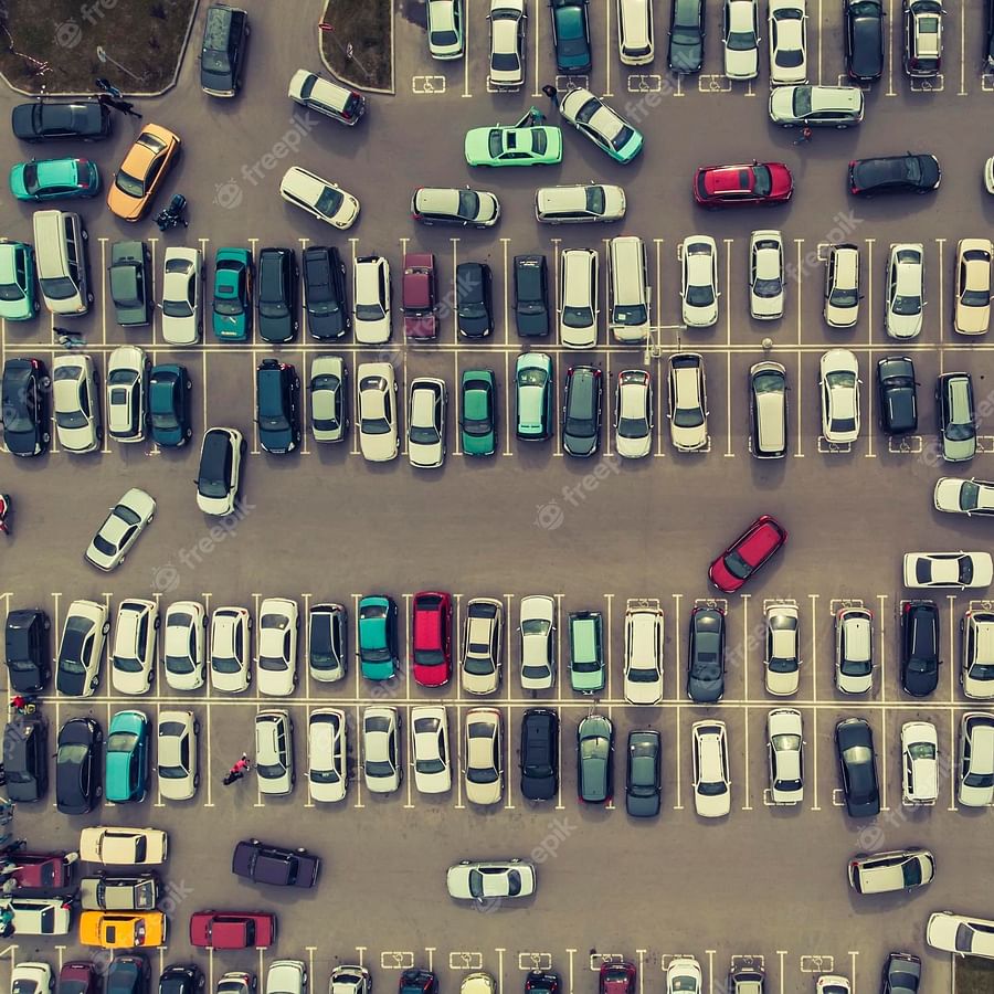 Crowded city center parking lot illustrating the challenges of finding a parking spot